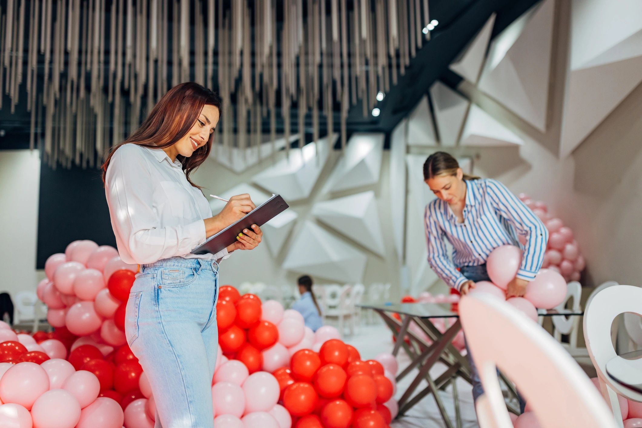 Team of event planners collaborating on a colorful party design